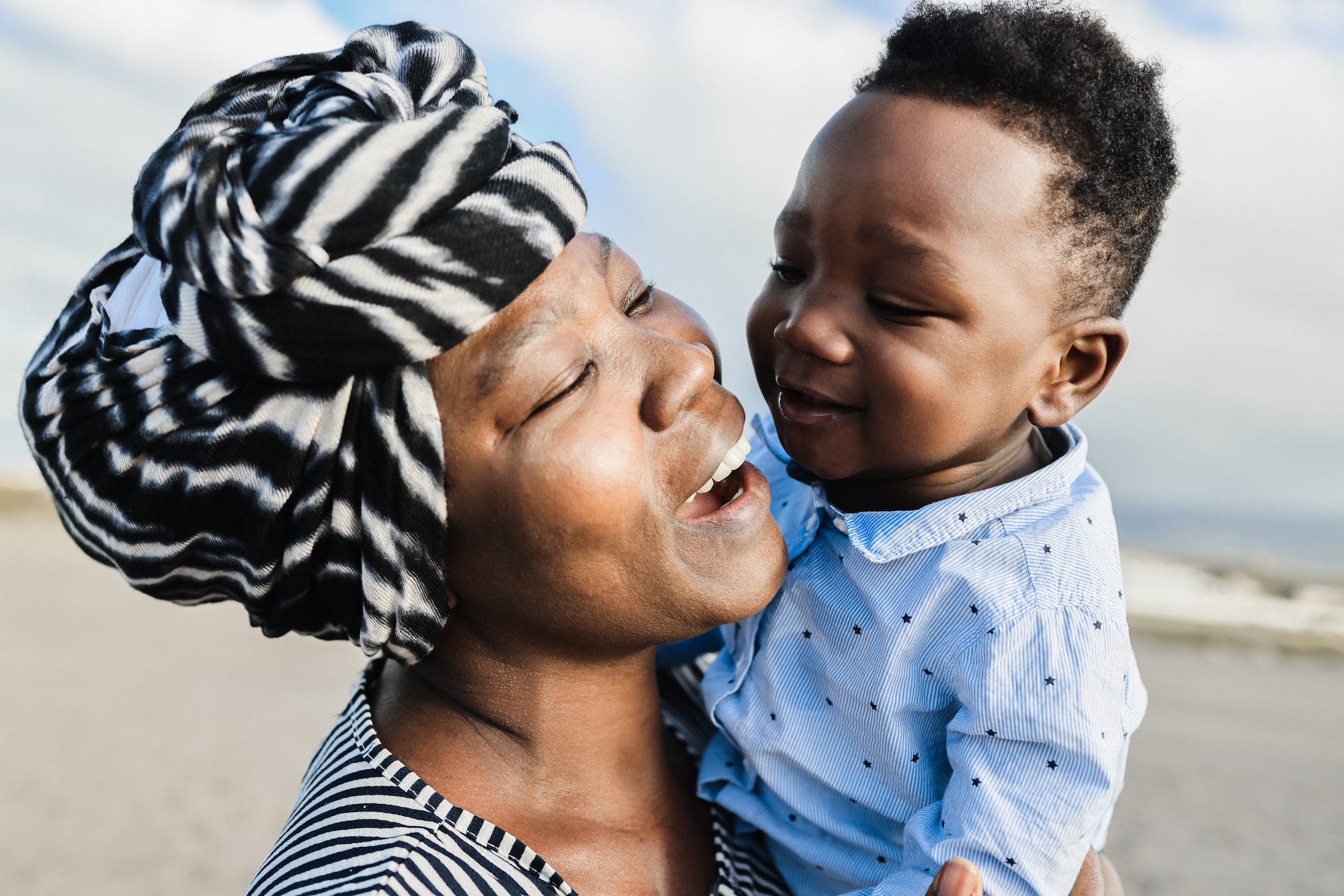 African mother having tender moment with little son